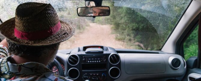 Basics of Off Roading: How to Get Started 25 Man in a wicker hat driving down a dirt road | image for the Basics of Off Roading: How to Get Started blog.