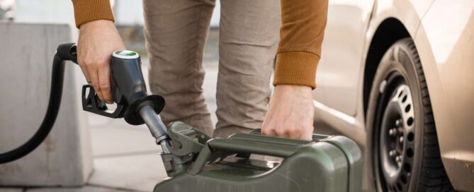 Calculating Fuel Consumption: How to Work Out Your Needs & Costs 25 Man refilling canister with fuel on the petrol station | Featured image of the Calculating Fuel Consumption: How to Work Out Your Needs & Costs blog for Bus 4x4 Group
